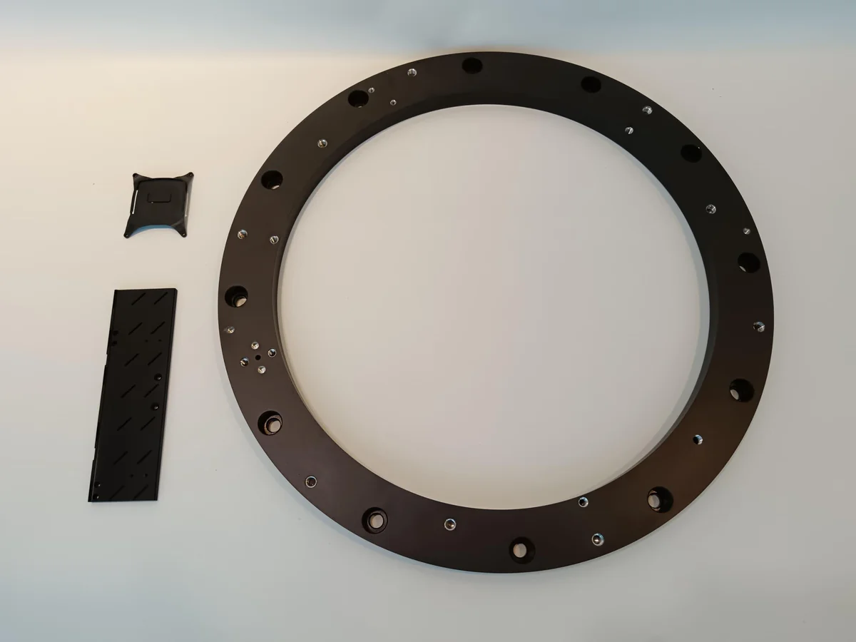 Precision machined black anodised ring component by TPTW Engineering